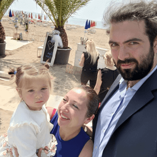 a happy family chilling on the beach